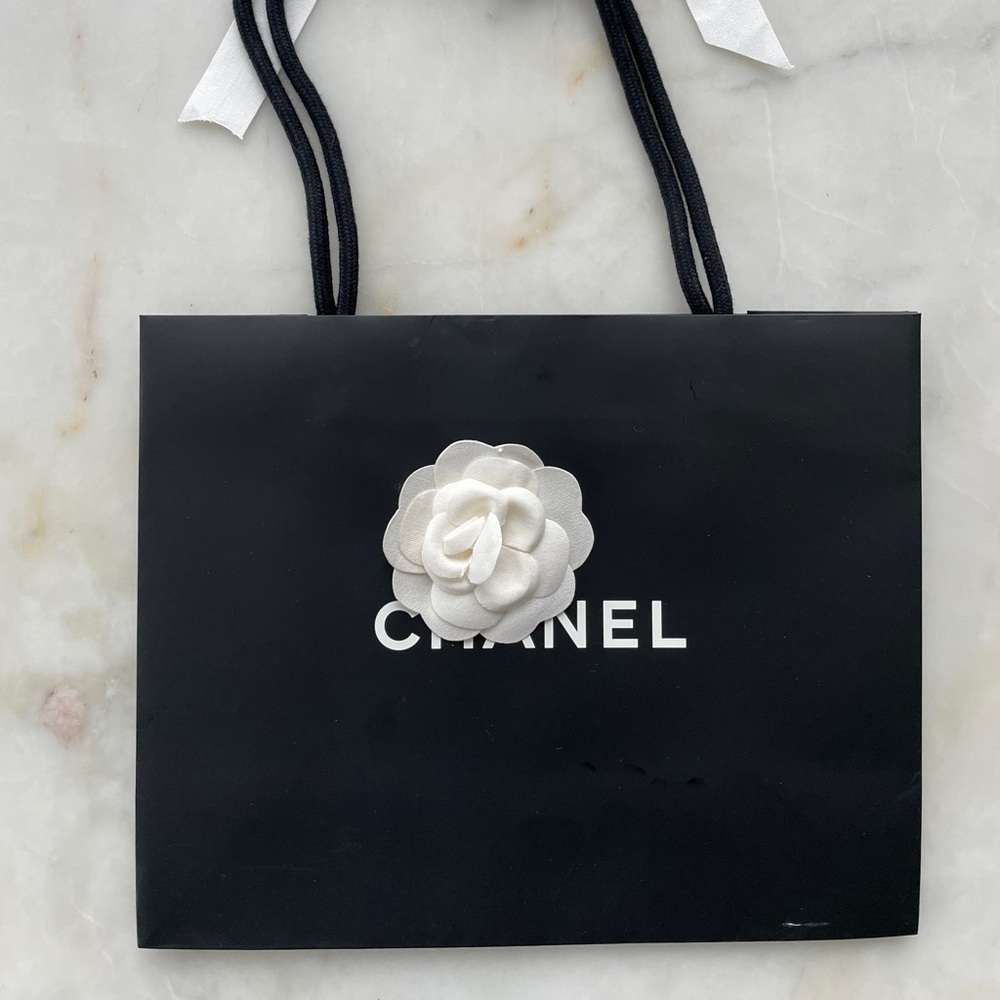 Chanel paper bag, with flower and ribbon